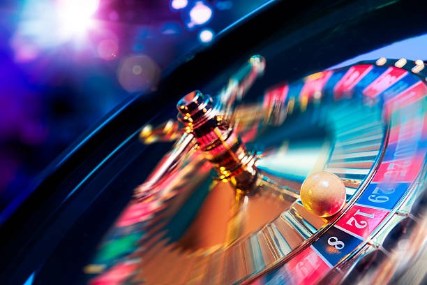 Multi-camera live-dealer studio floor with professional lighting, gaming tables, and dealer stations broadcasting to mobile players